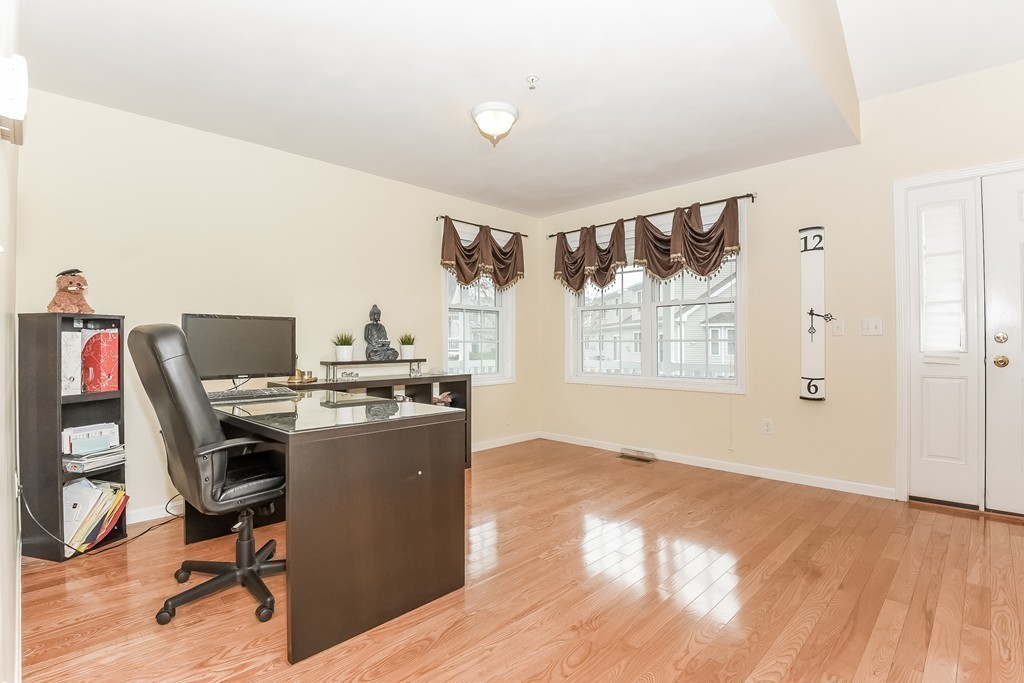 615 Nashua Road, Unit 9 Dracut, MA 01826 - Photo 11 of 30 a view of a workspace with furniture and a window