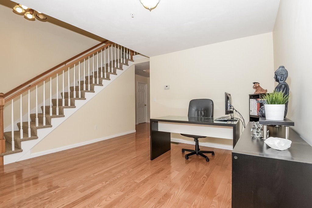 615 Nashua Road, Unit 9 Dracut, MA 01826 - Photo 13 of 30 a view of a workspace with furniture and a potted plant