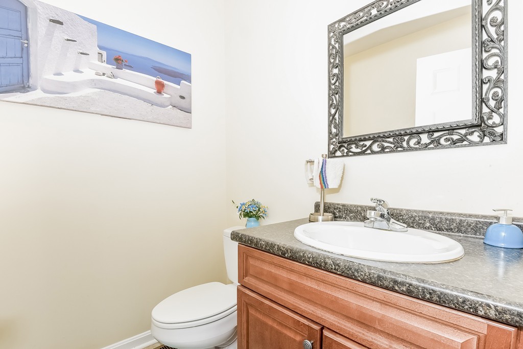 615 Nashua Road, Unit 9 Dracut, MA 01826 - Photo 20 of 30 a bathroom with a sink and a mirror