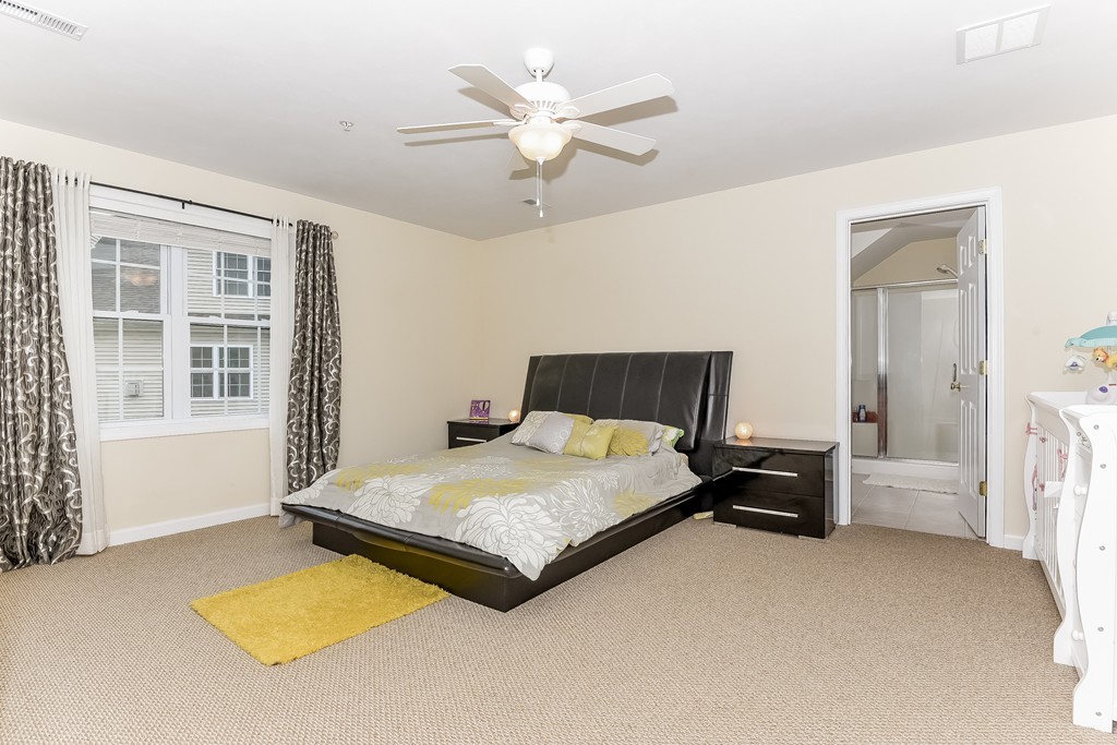 615 Nashua Road, Unit 9 Dracut, MA 01826 - Photo 21 of 30 a bedroom with a bed and window