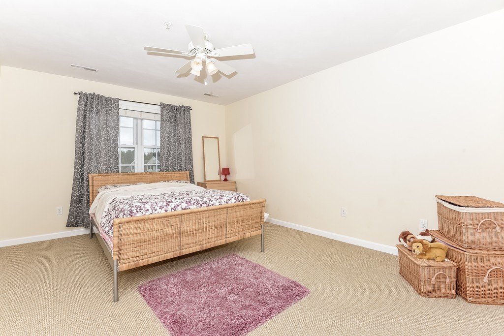 615 Nashua Road, Unit 9 Dracut, MA 01826 - Photo 27 of 30 a bedroom with a bed and window