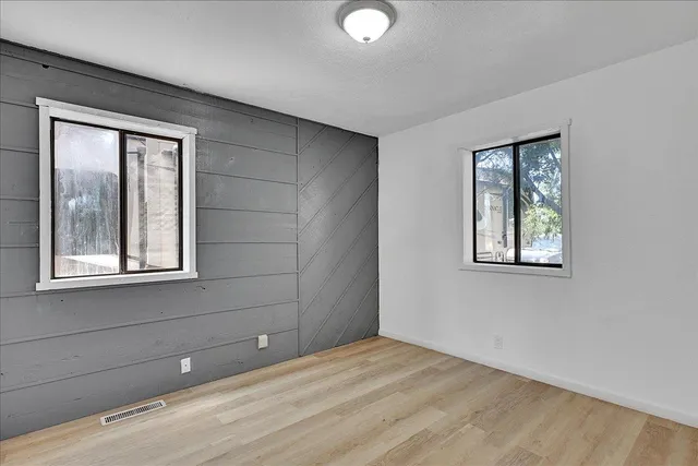 a view of an empty room with a window