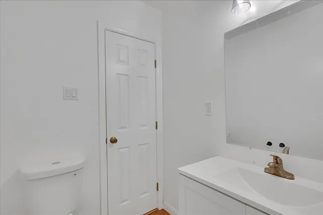 a view of a house with backyard and a tree