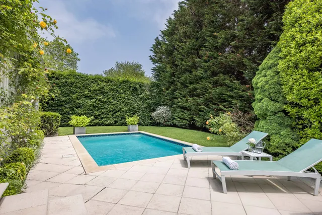 a view of swimming pool with chairs