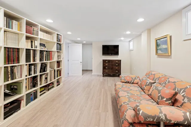 a bedroom with a bed and a television