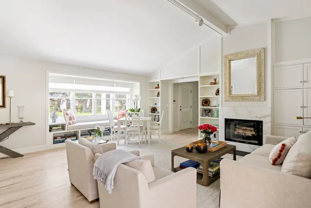 a living room with furniture fireplace and a flat screen tv