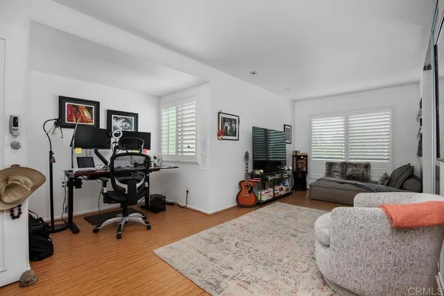 a view of a livingroom with workspace and a couch