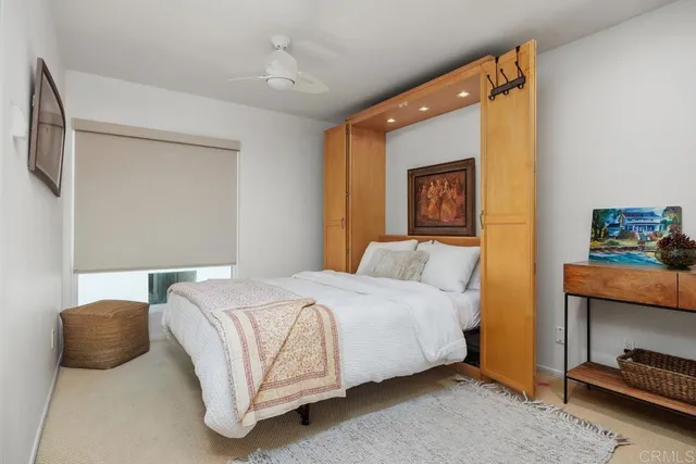 a bedroom with a bed and a couch