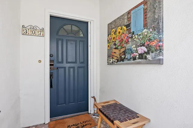 a view of an entryway with wooden floor