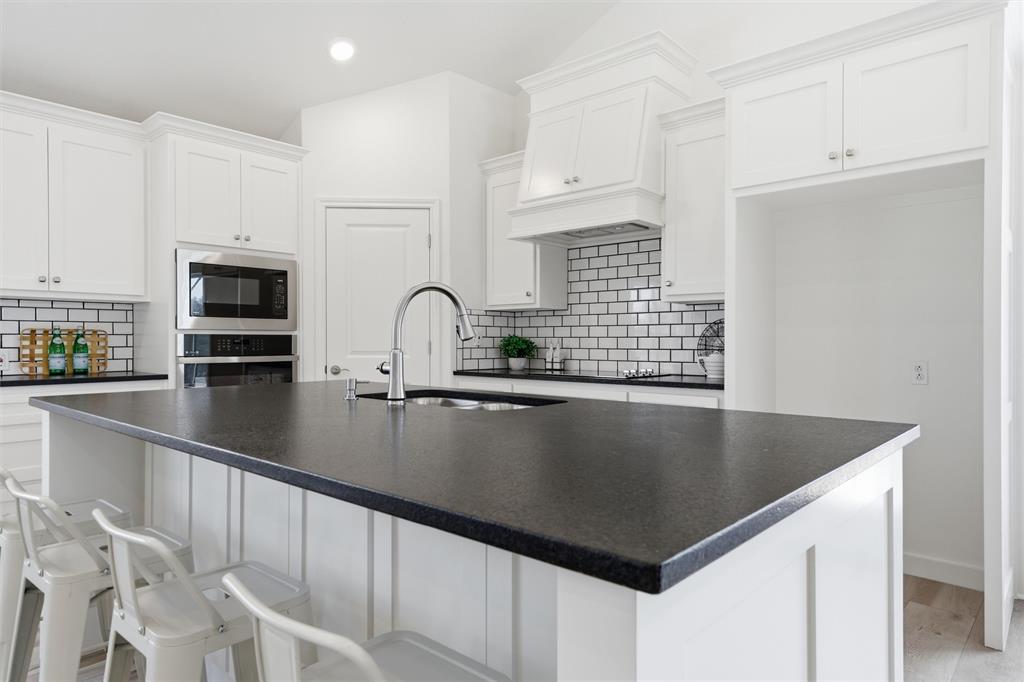2303 Pilgrim Lane Lorena, TX 76655 - Photo 7 of 38 a view of kitchen sink and microwave