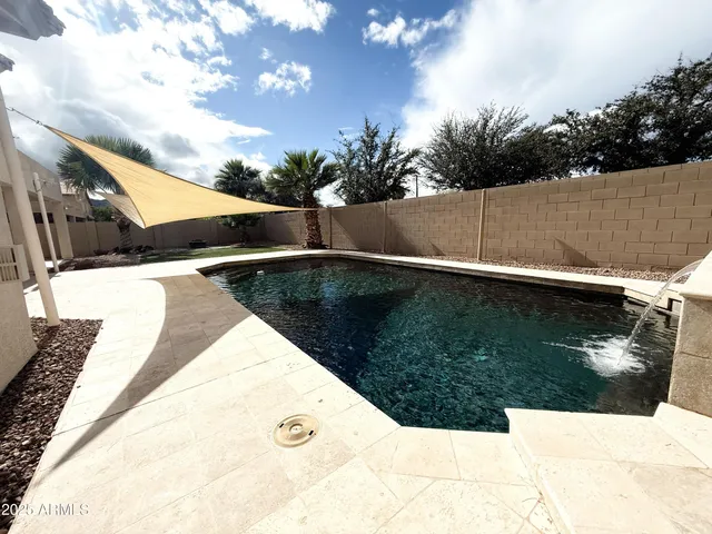 a view of outdoor space and swimming pool