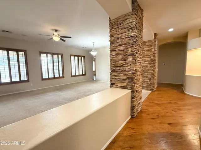 a spacious bathroom with a bathtub and shower
