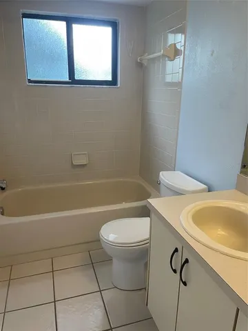 a bathroom with a sink a toilet and a bathtub