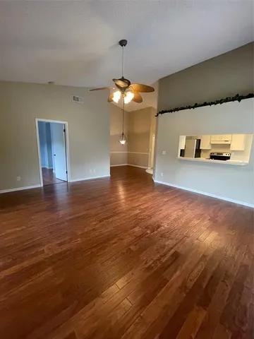 a view of a livingroom with wooden floor