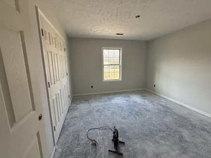 a view of an empty room and window