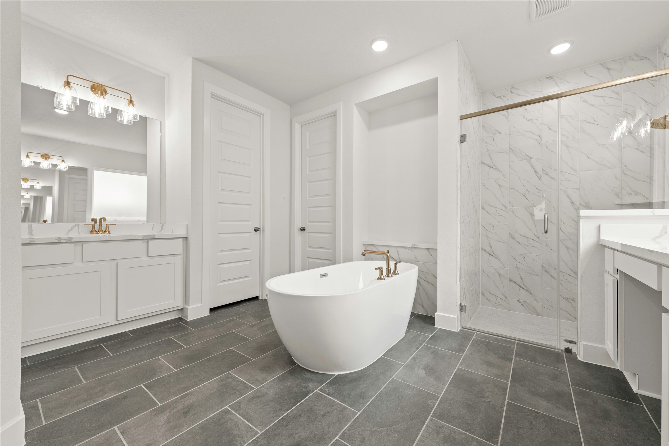 18917 Moonriver Street Conroe, TX 77302 - Photo 9 of 28 a spacious bathroom with a bathtub and shower