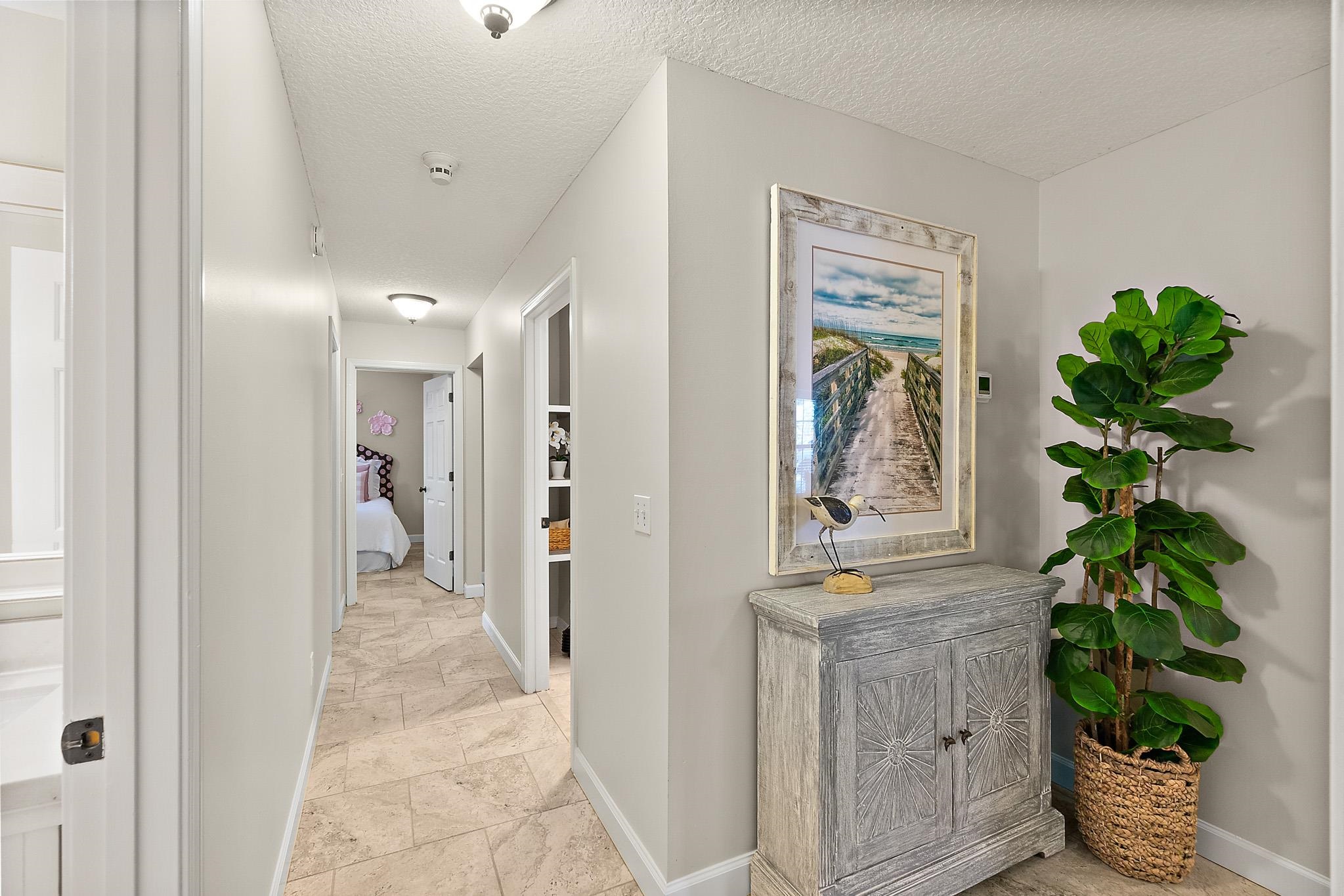 3253 Turtle Creek Road St. Augustine, FL 32086 - Photo 21 of 40 Corridor with baseboards and a textured ceiling