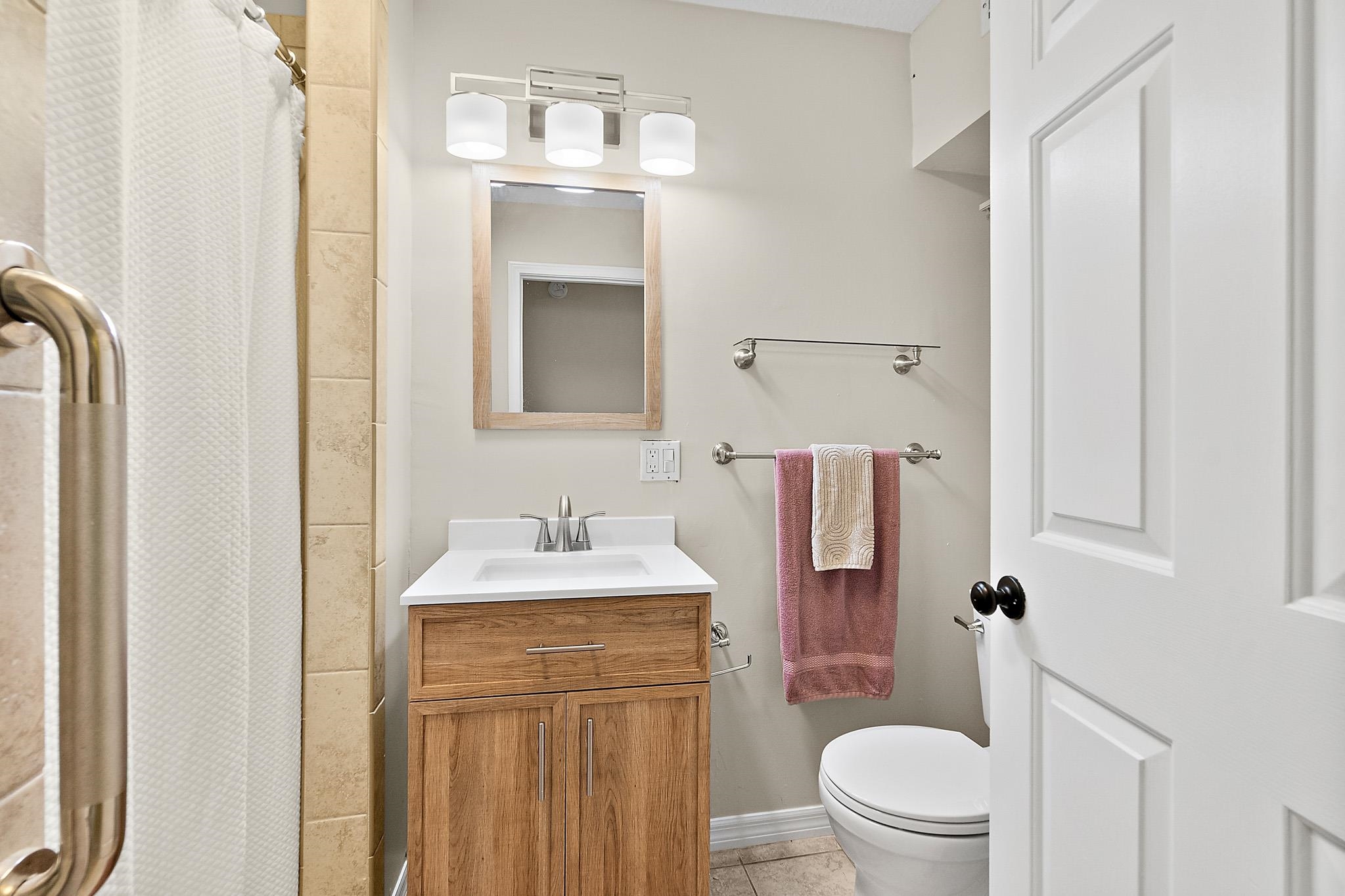 3253 Turtle Creek Road St. Augustine, FL 32086 - Photo 26 of 40 Bathroom featuring vanity, curtained shower, and light tile patterned floors