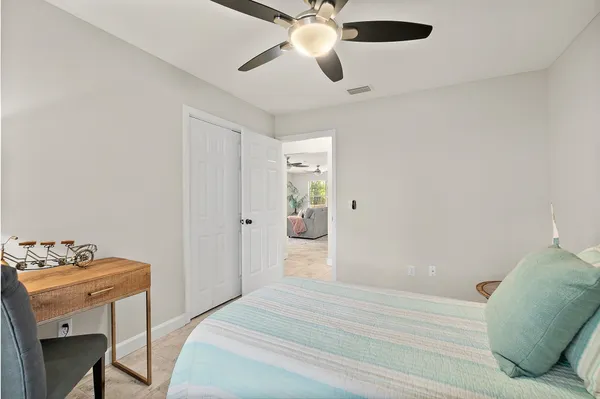 a bedroom with a bed and a table