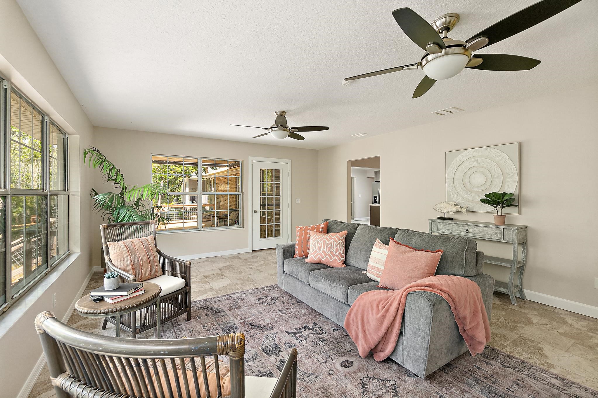 3253 Turtle Creek Road St. Augustine, FL 32086 - Photo 29 of 40 Living room featuring ceiling fan and stone finish flooring