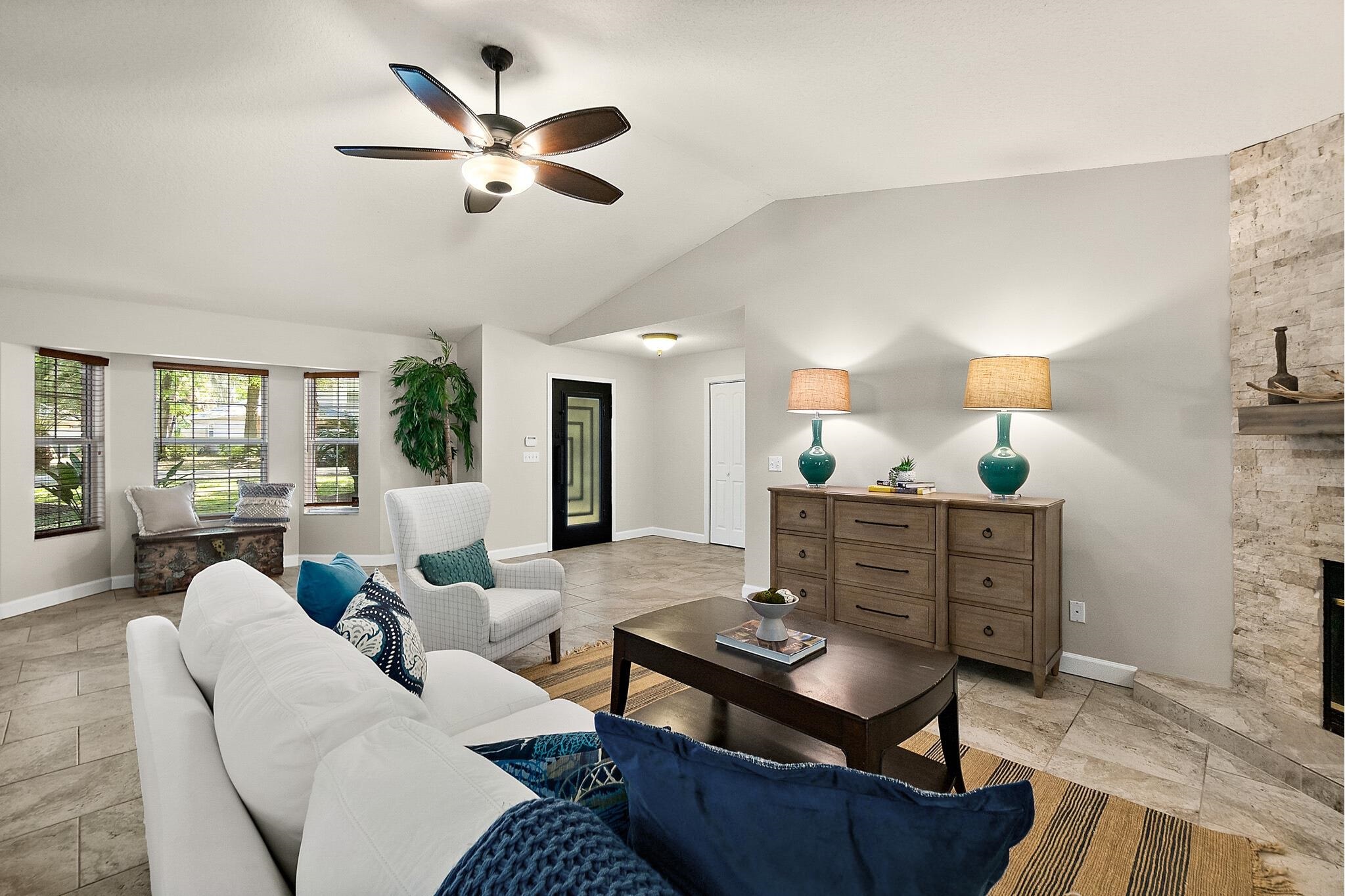 3253 Turtle Creek Road St. Augustine, FL 32086 - Photo 3 of 40 Living area with a stone fireplace and ceiling fan