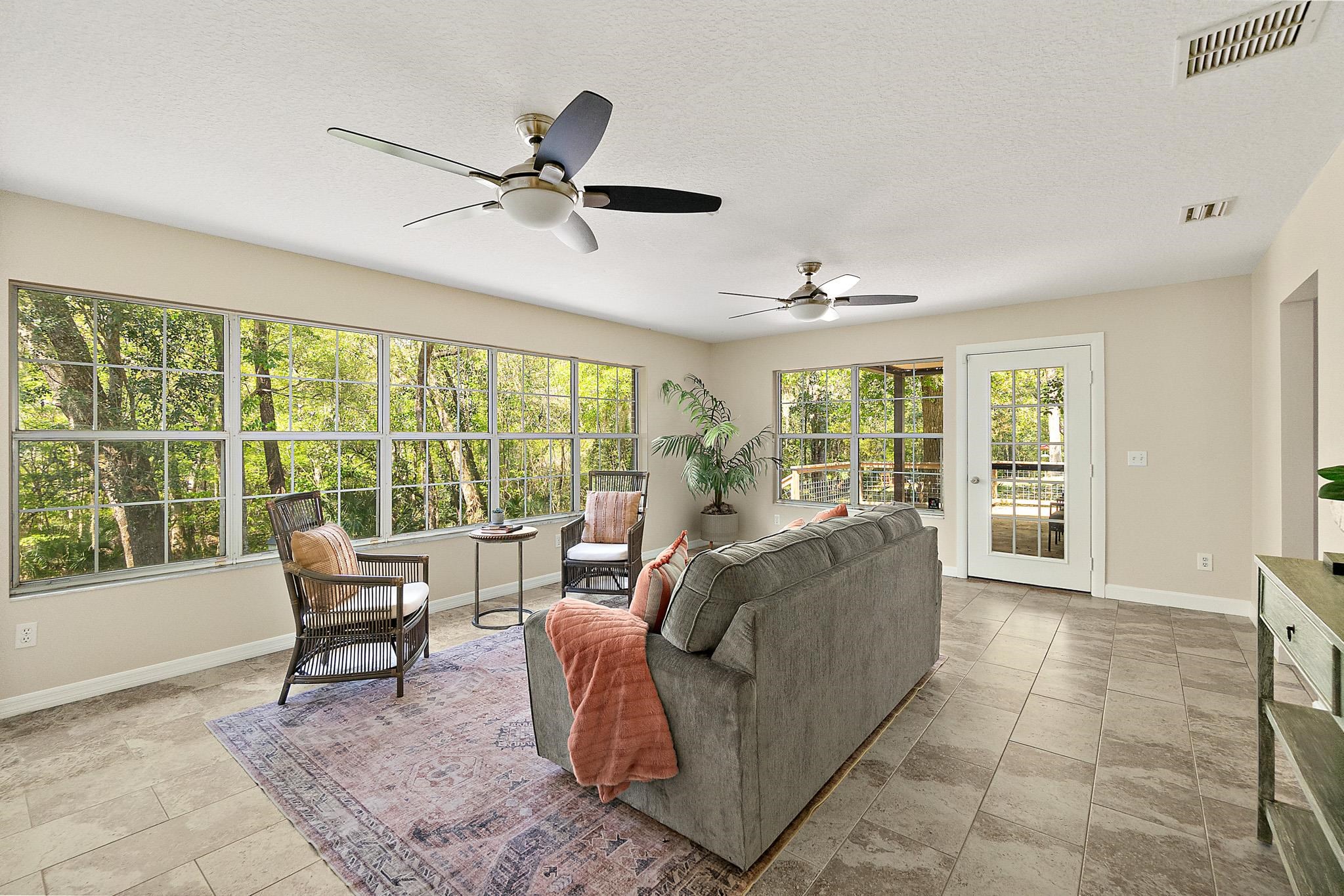 3253 Turtle Creek Road St. Augustine, FL 32086 - Photo 31 of 40 Living area featuring a textured ceiling and ceiling fan
