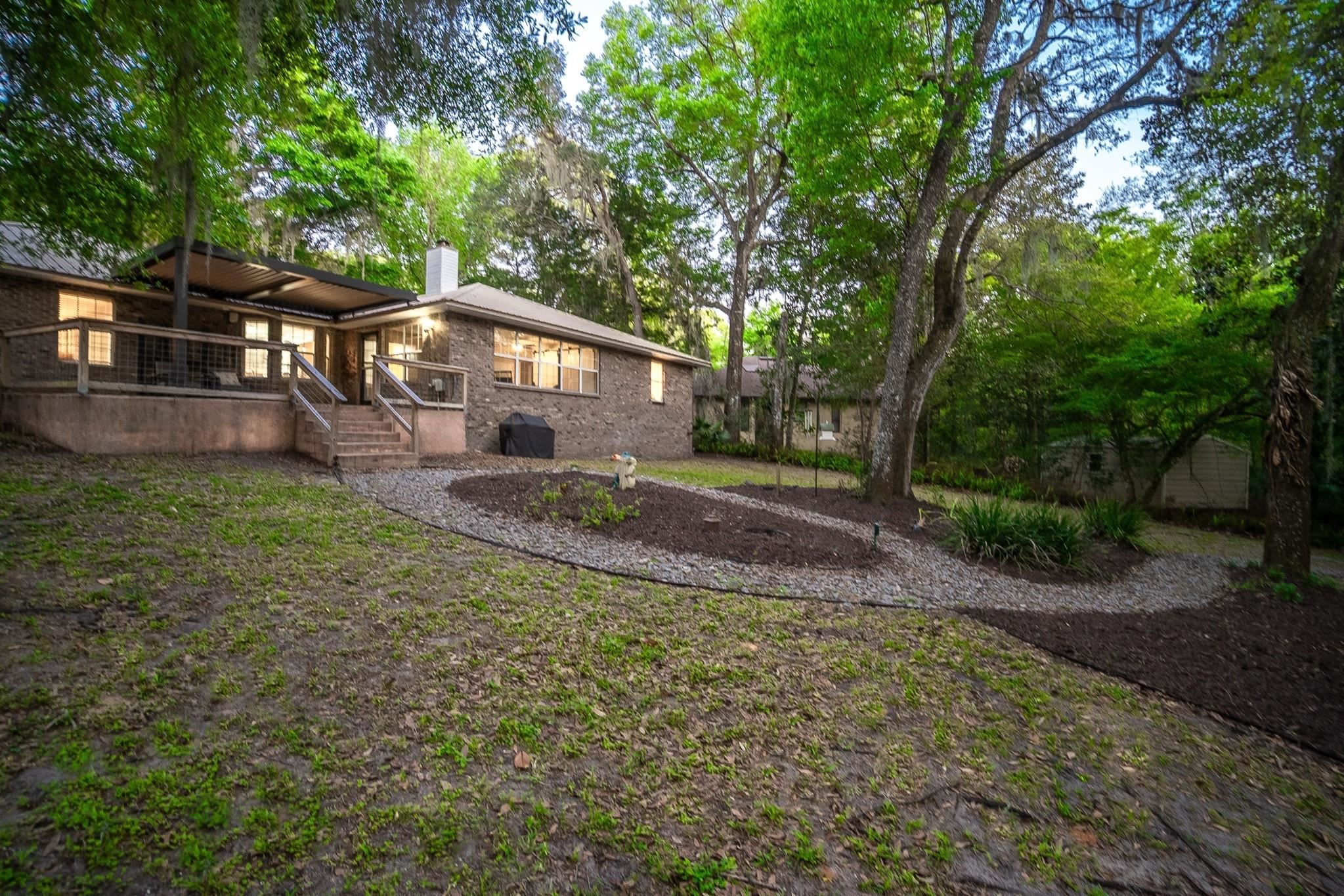 3253 Turtle Creek Road St. Augustine, FL 32086 - Photo 38 of 40 Rear view of house with a chimney, a deck, and brick siding