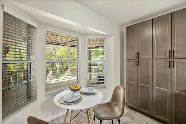 a view of a dining room and livingroom with furniture