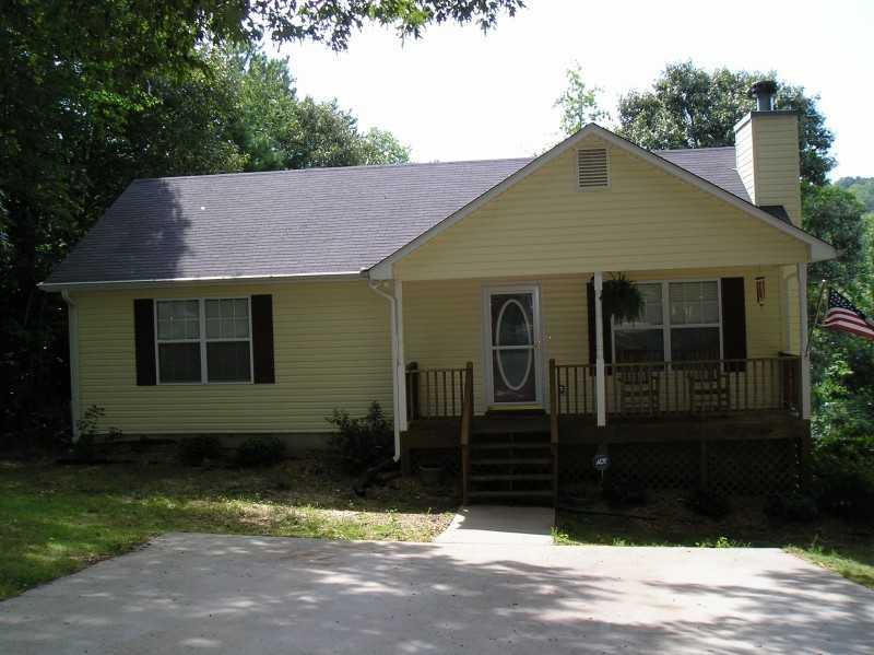 6325 Hickory Hills Road Cumming, GA 30041 - Photo 1 of 1 Exterior Front. View of front of home - notice front porch & beautiful hardwood trees