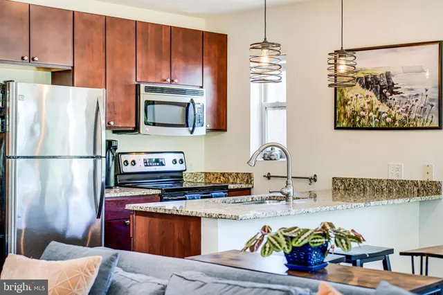 a kitchen with a sink and a window