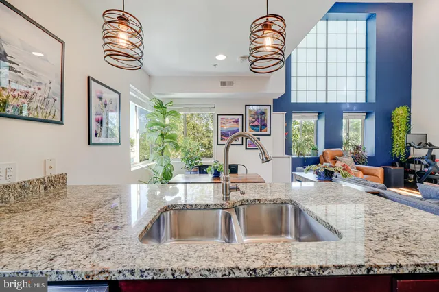 a kitchen with a sink and a refrigerator