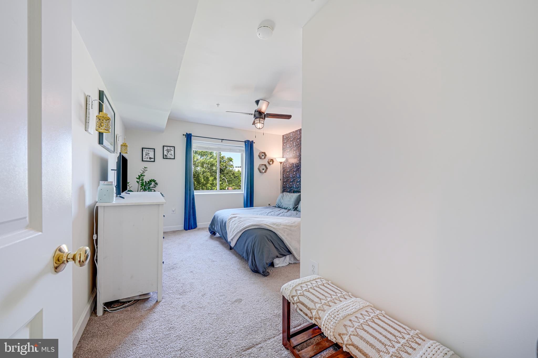 5407 9th Street Northwest, Unit 310 Washington, DC 20011 - Photo 39 of 53 a bedroom with furniture and a window