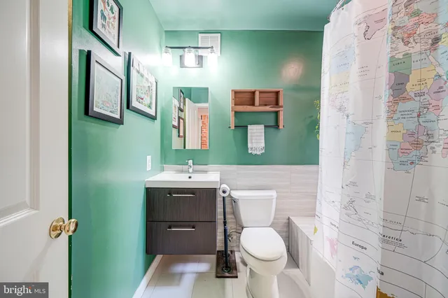 a bathroom with a sink and a washing machine
