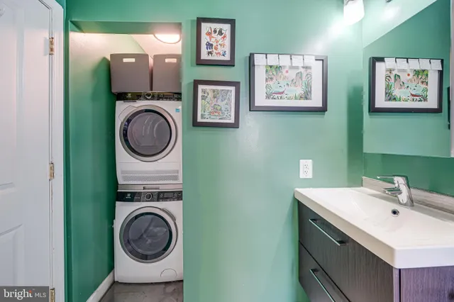 a view of a hallway with washer and dryer