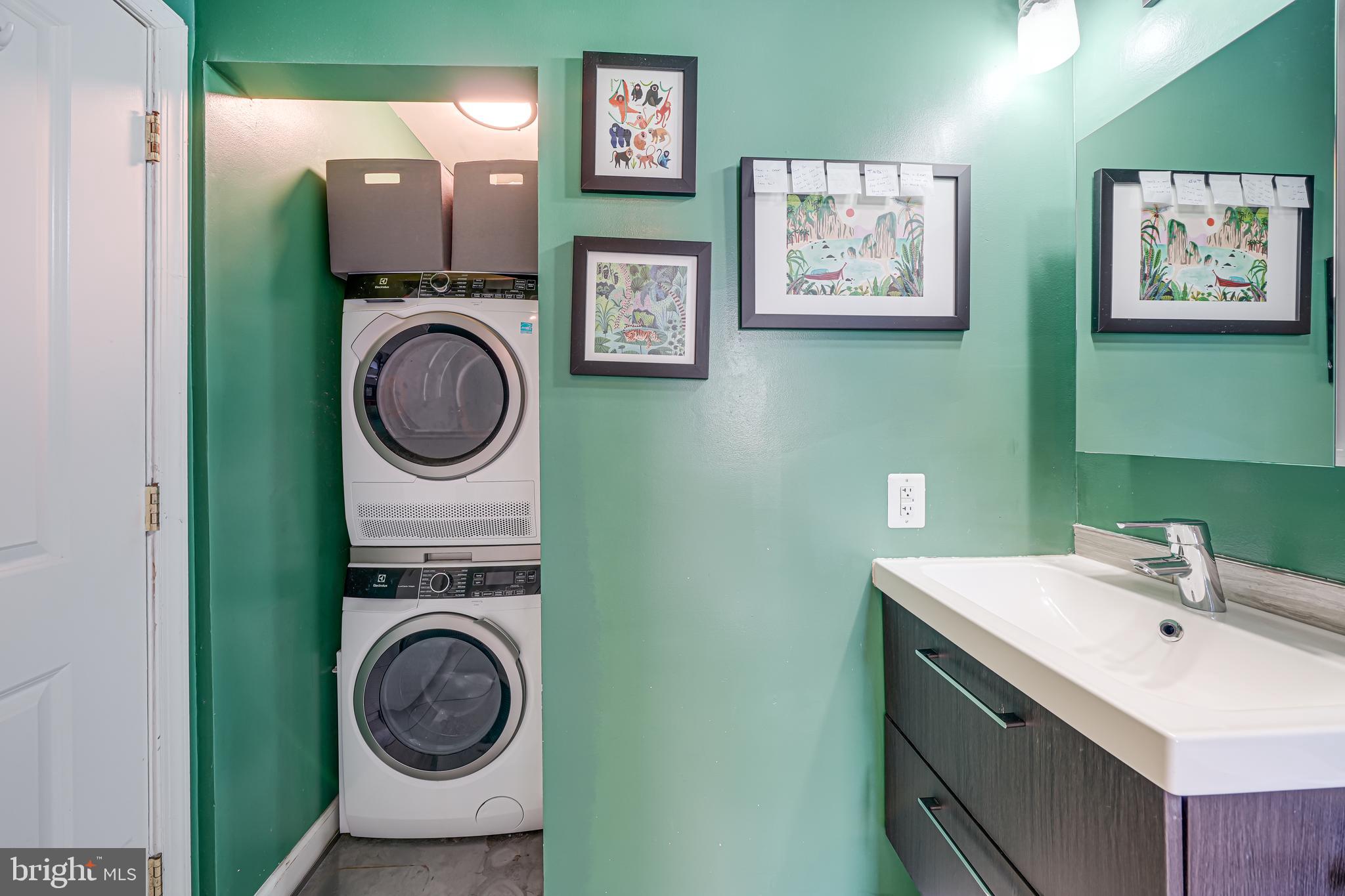 5407 9th Street Northwest, Unit 310 Washington, DC 20011 - Photo 42 of 53 a bathroom with a sink and a washing machine