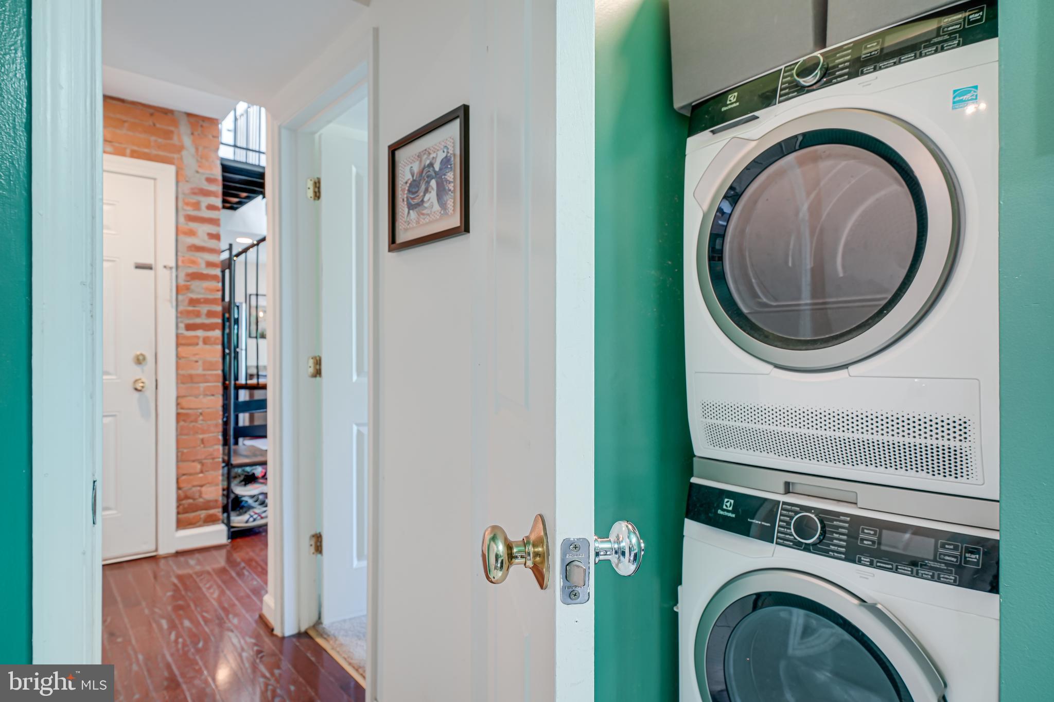 5407 9th Street Northwest, Unit 310 Washington, DC 20011 - Photo 43 of 53 a view of a hallway with washer and dryer