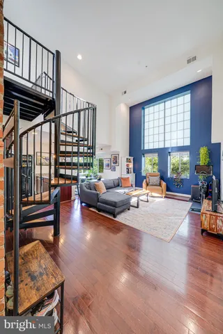 an aerial view of a livingroom with furniture and a couch