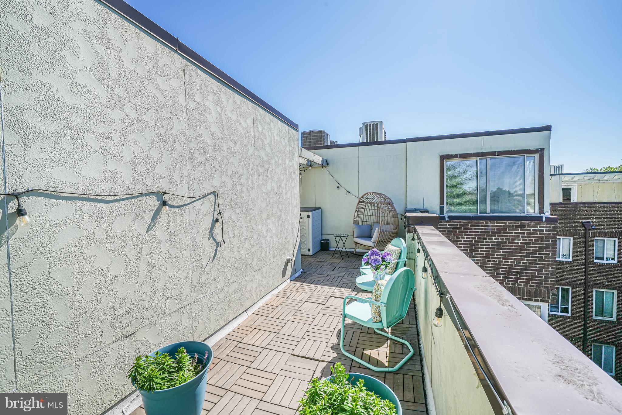 5407 9th Street Northwest, Unit 310 Washington, DC 20011 - Photo 51 of 53 a bed room with a bed and a couch