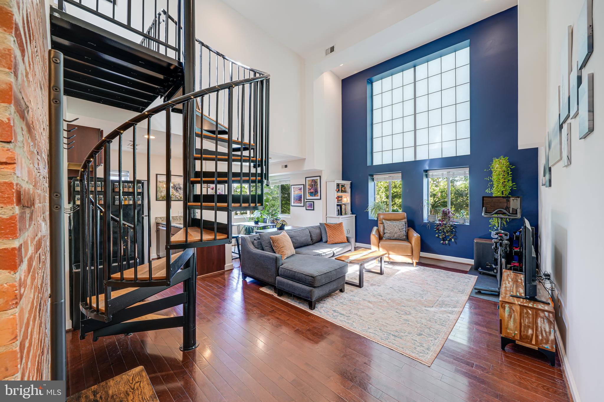 5407 9th Street Northwest, Unit 310 Washington, DC 20011 - Photo 9 of 53 a living room with furniture fireplace and a large window