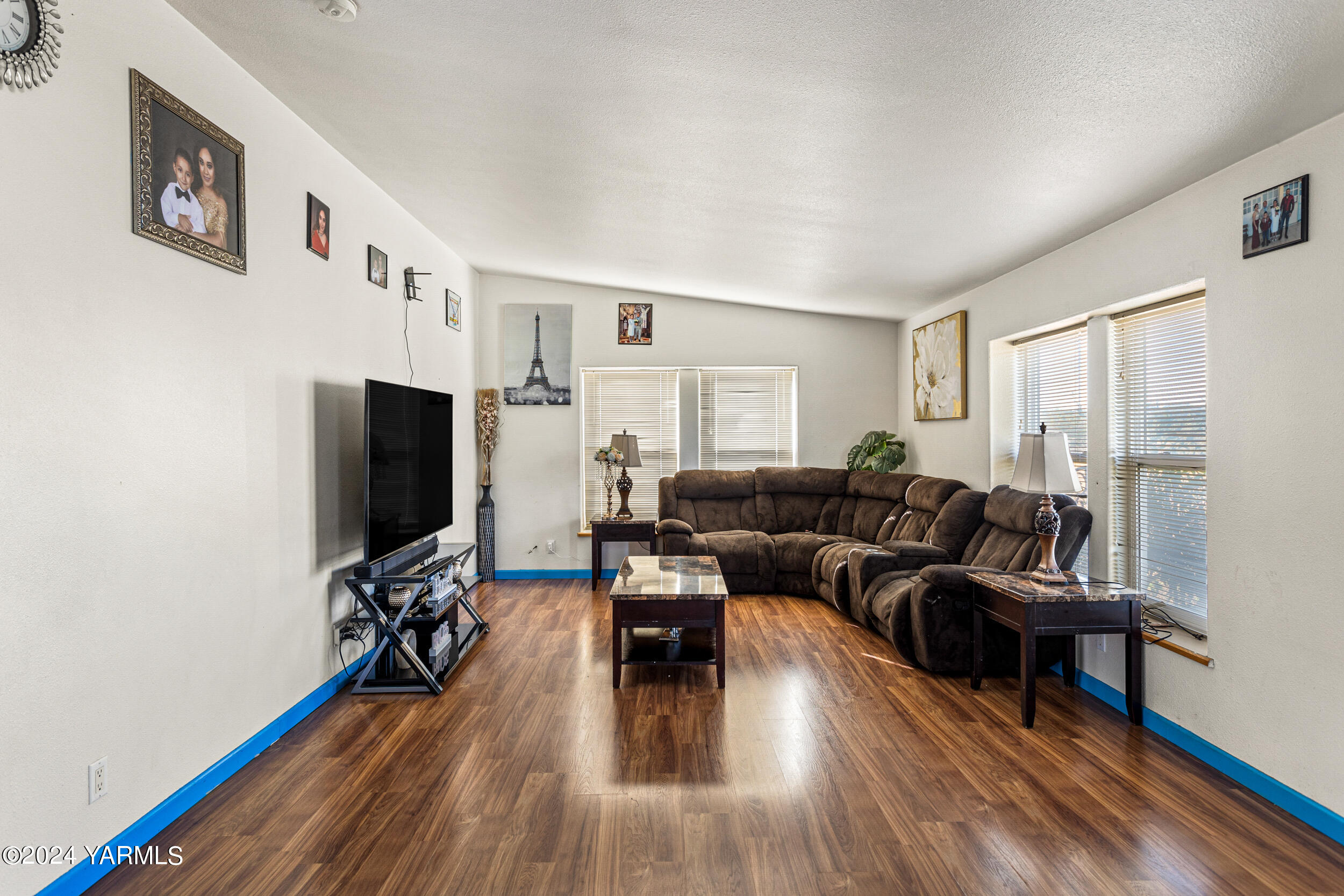 1649 Progressive Road Wapato, WA 98951 - Photo 14 of 30 a living room with furniture and a flat screen tv