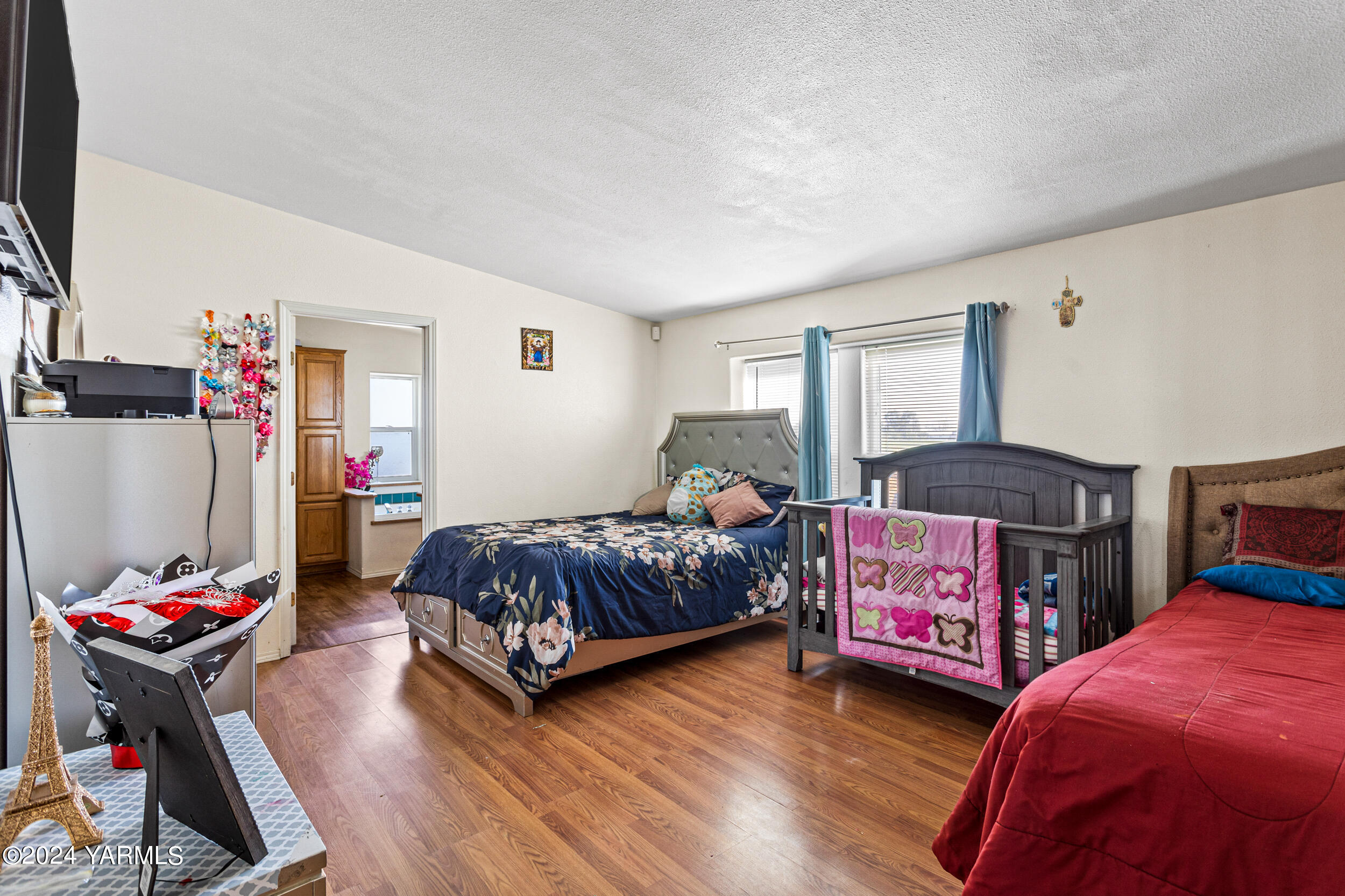 1649 Progressive Road Wapato, WA 98951 - Photo 20 of 30 a bedroom with furniture and a wooden floor
