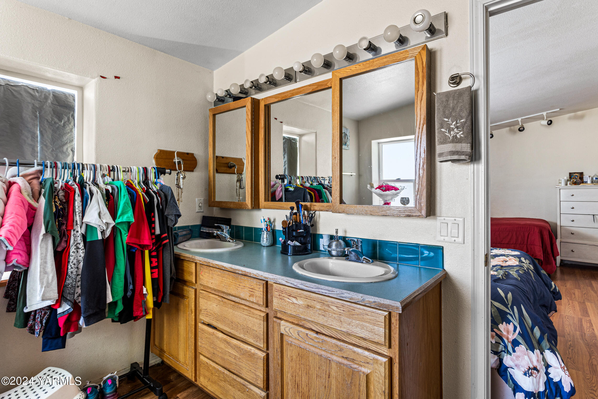 1649 Progressive Road Wapato, WA 98951 - Photo 23 of 30 a view of walk in closet with clothes and shoes