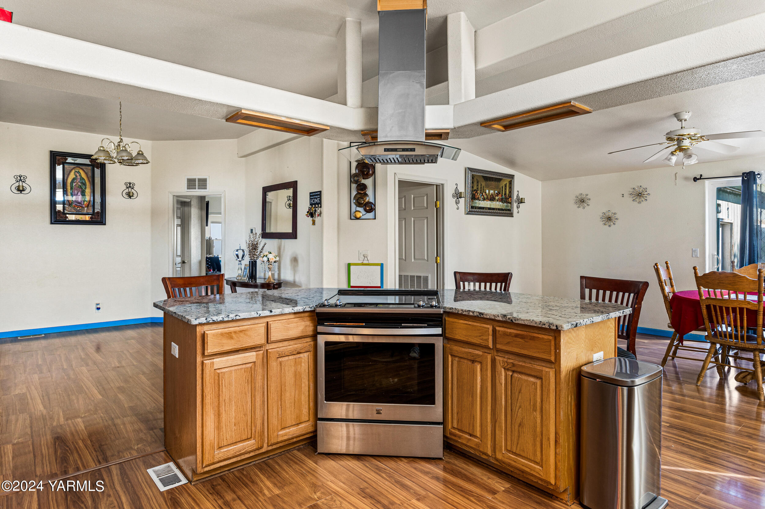 1649 Progressive Road Wapato, WA 98951 - Photo 3 of 30 a kitchen with stainless steel appliances granite countertop a stove and a refrigerator