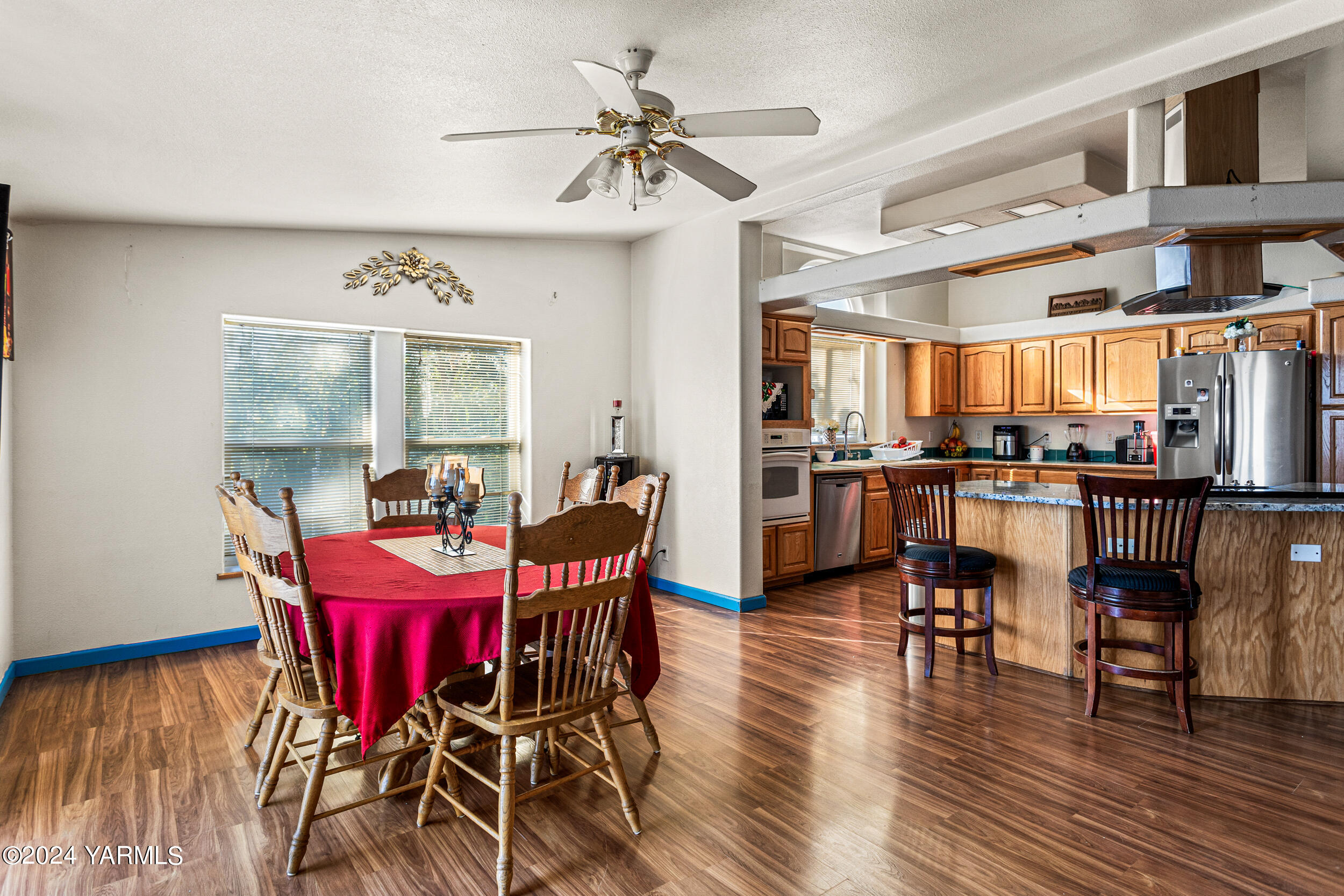 1649 Progressive Road Wapato, WA 98951 - Photo 10 of 30 a view of a dining room with furniture window and wooden floor