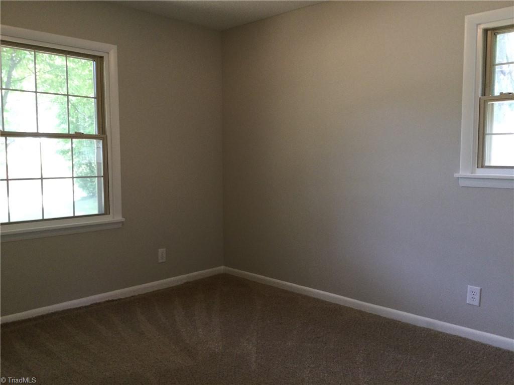 3230 Wide Country Road Pfafftown, NC 27040 - Photo 27 of 39 Bedroom 2: Features include carpet flooring to help keep your feet warm on cool morning, 2 windows for natural lighting and fresh new paint.