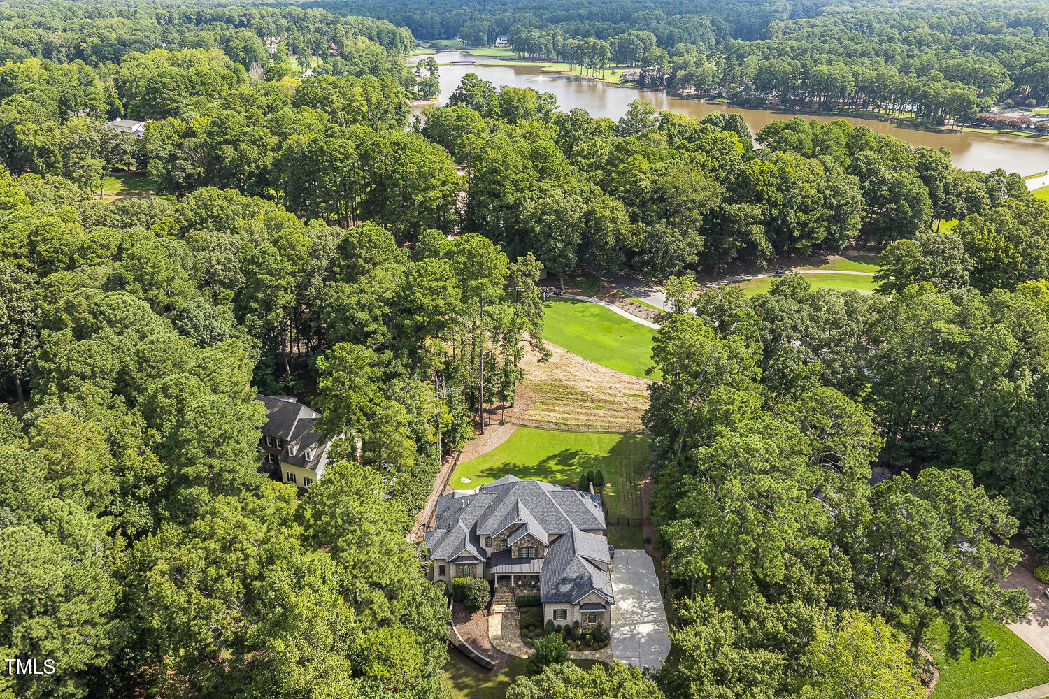 1205 Queensferry Road Cary, NC 27511 - Photo 2 of 63 an aerial view of a house with a yard and lake view