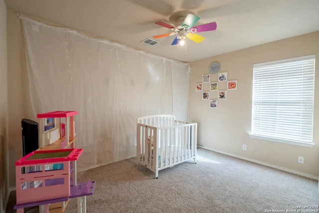 a view of a house with a yard potted plants and a lake view