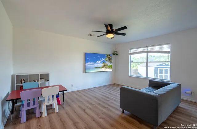 a living room with furniture and a window