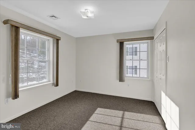 an empty room with windows