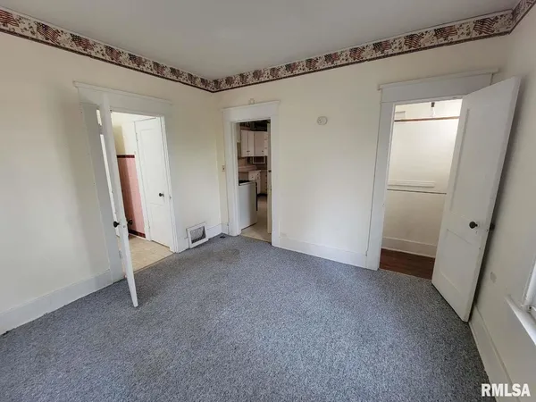 a view of a room with an entryway